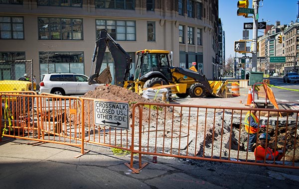 <img src="right-of-way.jpg" alt="right-of-way work on busy city street with fenced off sidewalk">