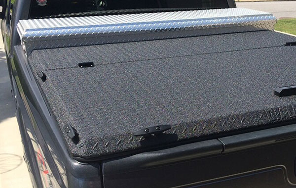 <img src="truck-bed-toolbox-2.jpg" alt="black pickup truck with silver toolbox">
