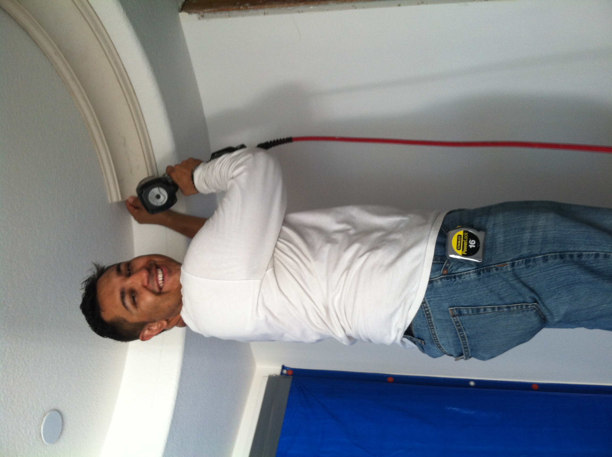 <img src="Mike1.jpg" alt="Mike Urquizo on a ladder using power tools">