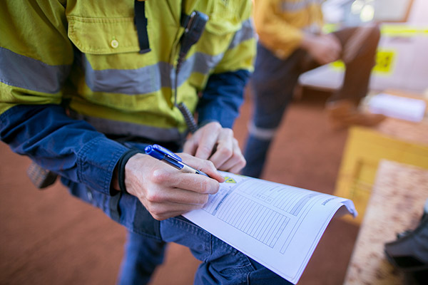Contractor signing paper